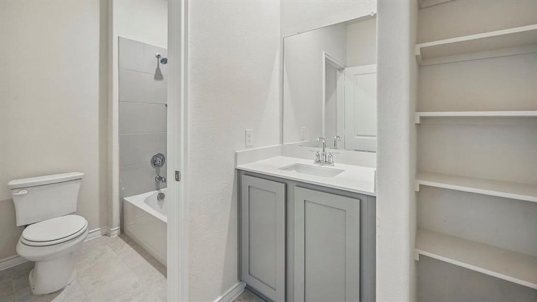 Bathroom with shower / washtub combination and vanity