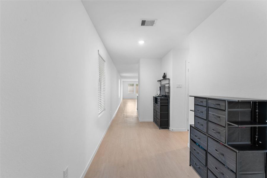 Hallway entry provides a direct transition from the front of the home into the main living areas.