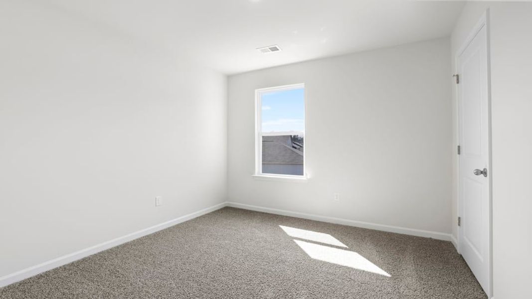 Spacious, unfurnished interior of a new home in Bentley Park, Greenwood (Image 30).