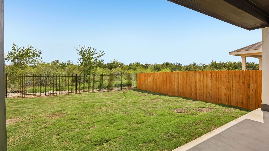 Exterior details and patio area of a home in Prairie Lakes, Buda (Image 4).