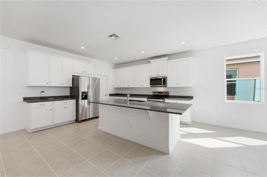 Furnished interior view inside a new home in Rainwood, Clermont (Image 8).