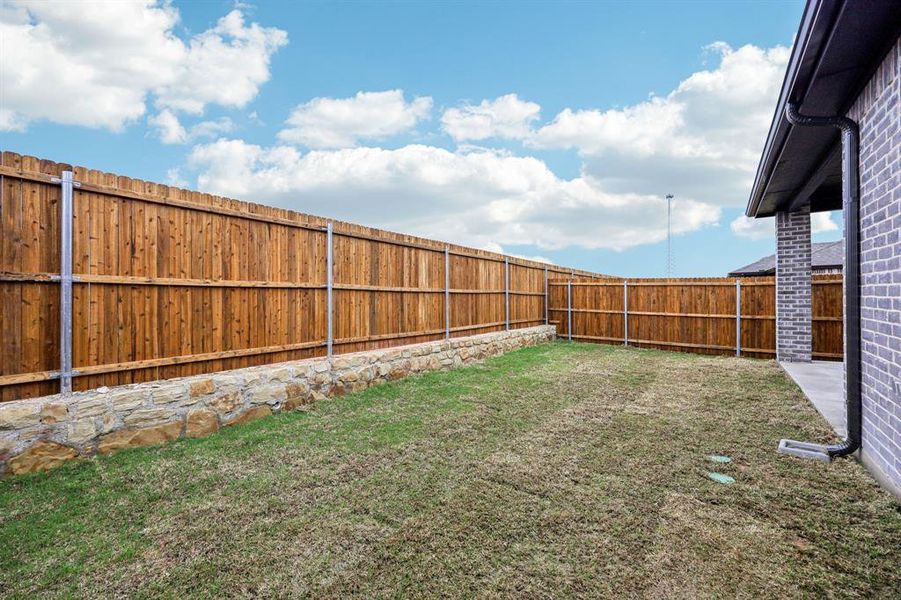 Exterior details and patio area of a home in Parks at Foster Crossing - Spring Series, Anna (Image 26).