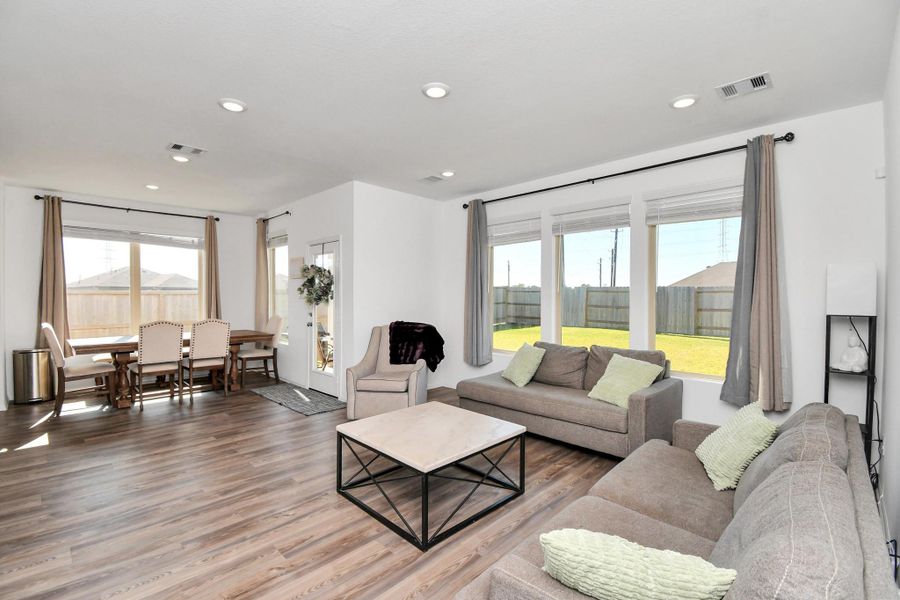 Gorgeous living space with open floor plan and plenty of light flowing through.