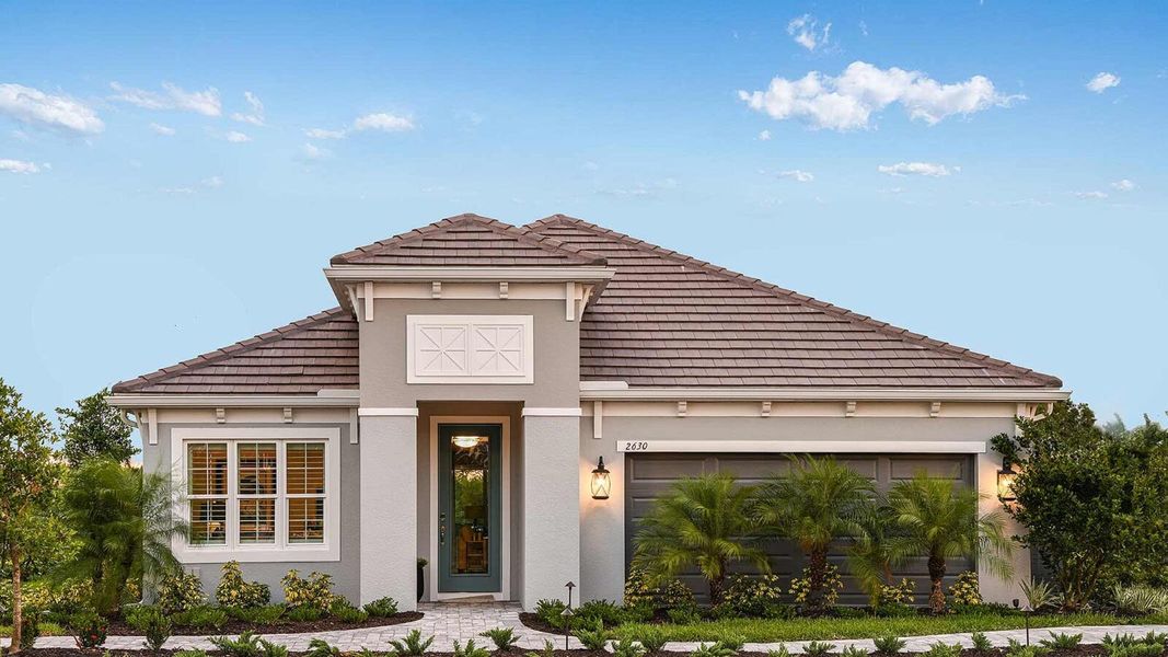 Front exterior of a new home in Windward, Lakewood Ranch, FL, highlighting curb appeal (Image 22). Front exterior of a new home in Windward, Lakewood Ranch, FL, highlighting curb appeal (Image 22).