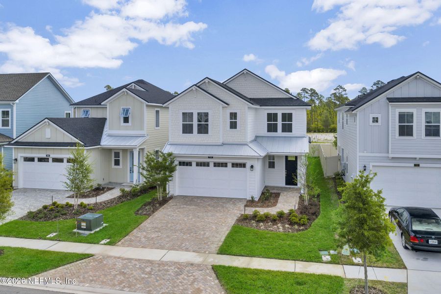 Front exterior of a new home in Seabrook Village at Seabrook, Nocatee, FL, highlighting curb appeal (Image 23).