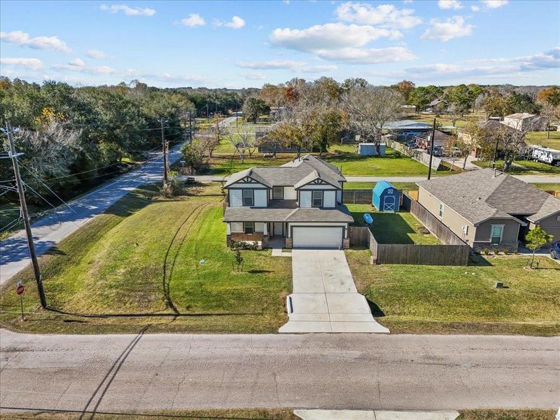 Front exterior of a new home in Mecom Way, Hitchcock, TX, highlighting curb appeal (Image 26). Front exterior of a new home in Mecom Way, Hitchcock, TX, highlighting curb appeal (Image 26).