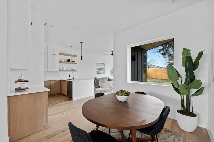 Dining space featuring light wood finished floors and baseboards