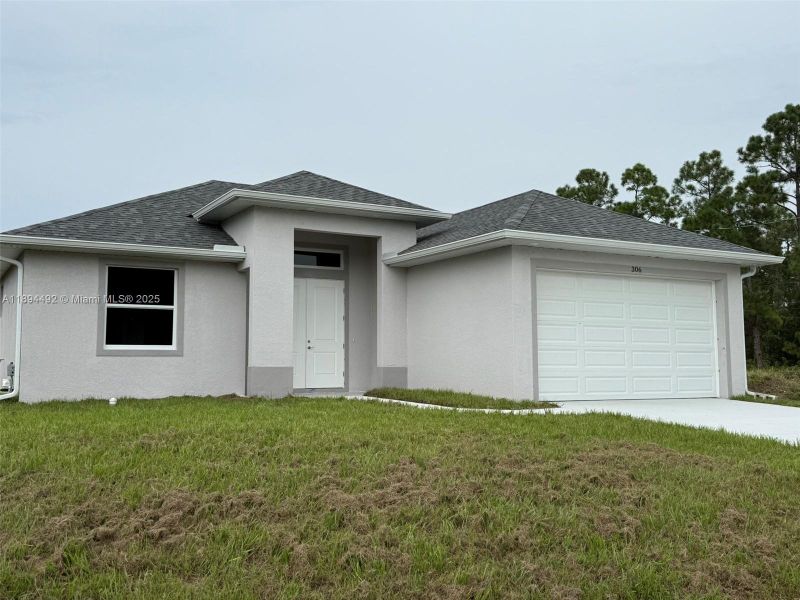 Exterior details and patio area of a home in , Lehigh Acres (Image 24). Exterior details and patio area of a home in , Lehigh Acres (Image 24).