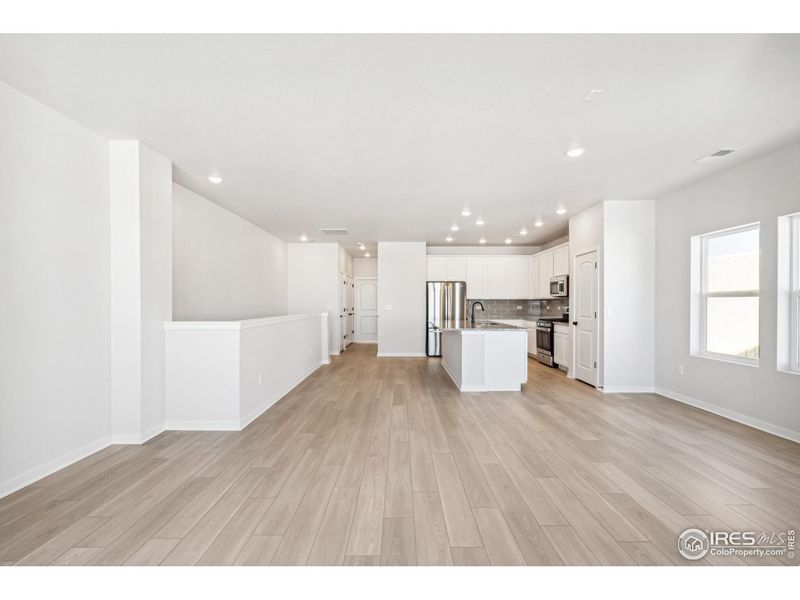 Spacious, unfurnished interior of a new home in Kinston Mainstreet Townhomes, Loveland (Image 33).