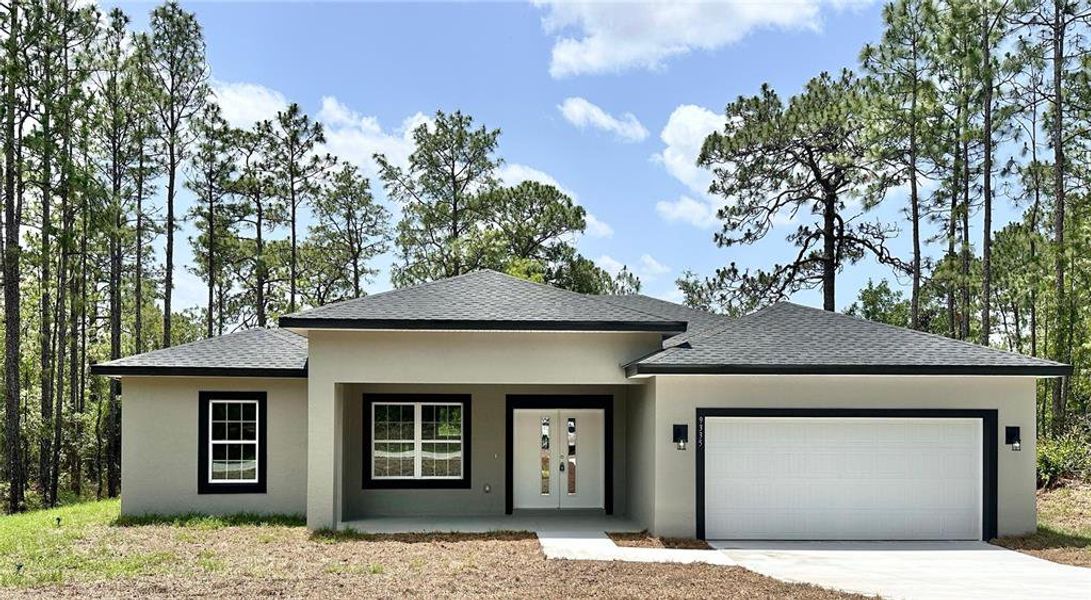 Front exterior of a new home in , Citrus Springs, FL, highlighting curb appeal (Image 18).