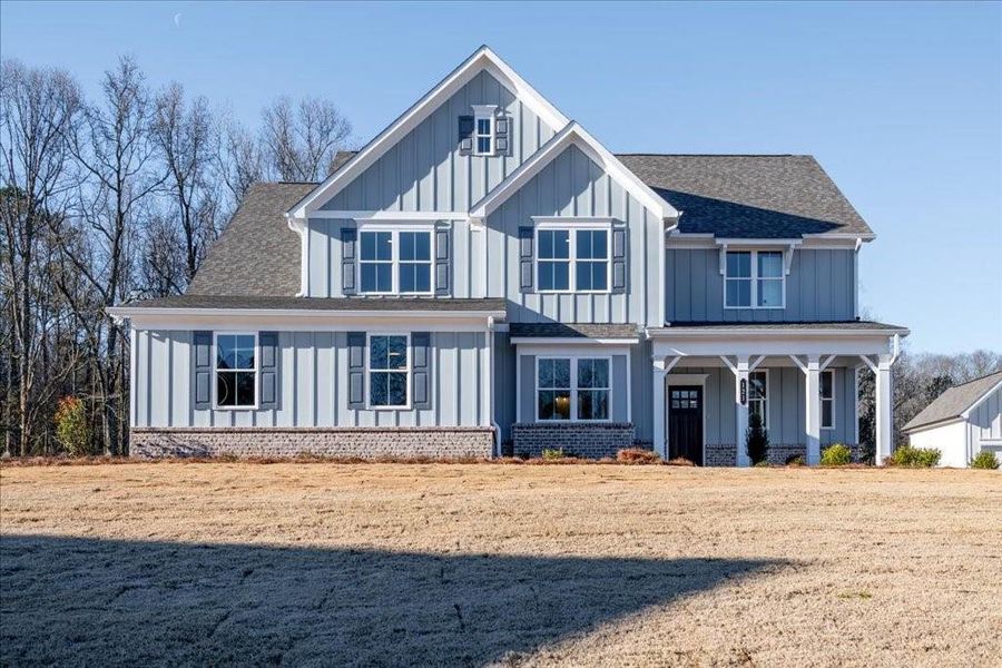 Front exterior of a new home in Autumn Brook, Canton, GA, highlighting curb appeal (Image 1).