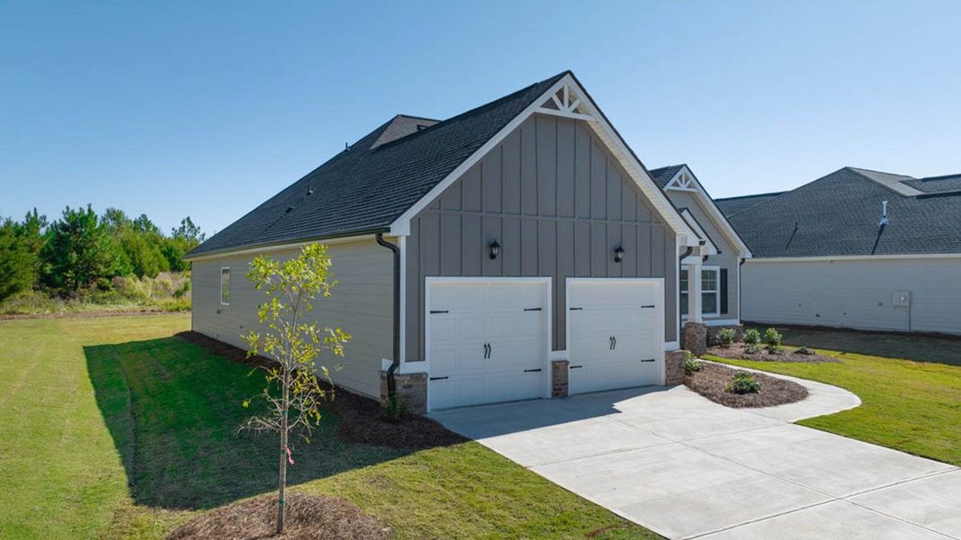 Front exterior of a new home in The Gates at Pates Creek, Hampton, GA, highlighting curb appeal (Image 2).