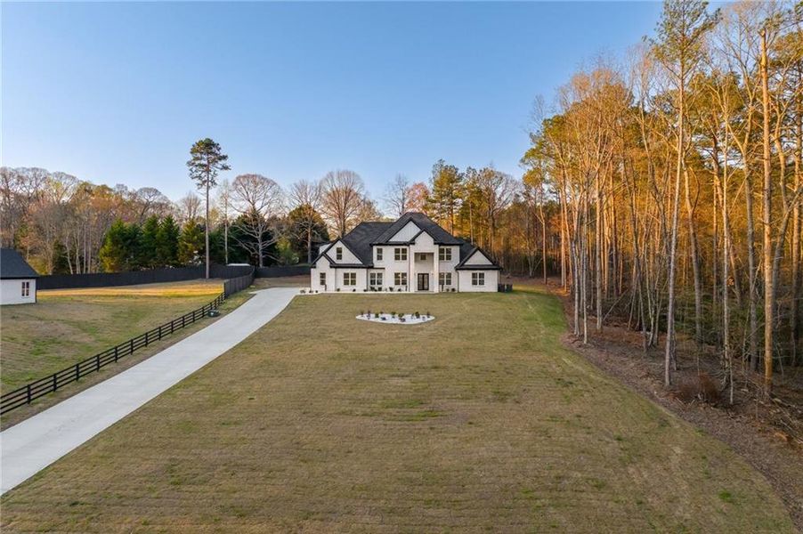Front exterior of a new home in , Loganville, GA, highlighting curb appeal (Image 35).