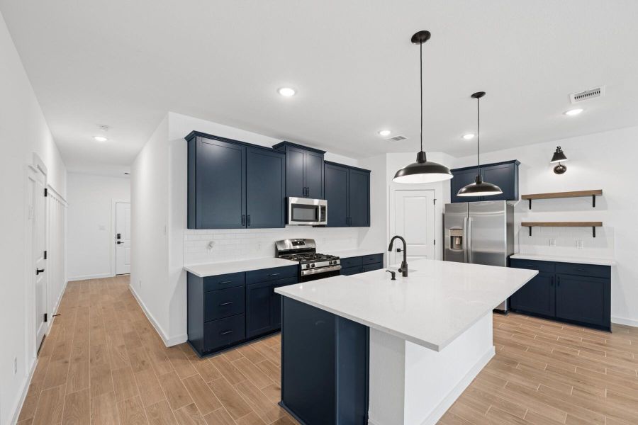 Gorgeous kitchen with blue cabinets and quartz counters (*Photo not of actual home and used for illustration purposes only.) Gorgeous kitchen with blue cabinets and quartz counters (*Photo not of actual home and used for illustration purposes only.)