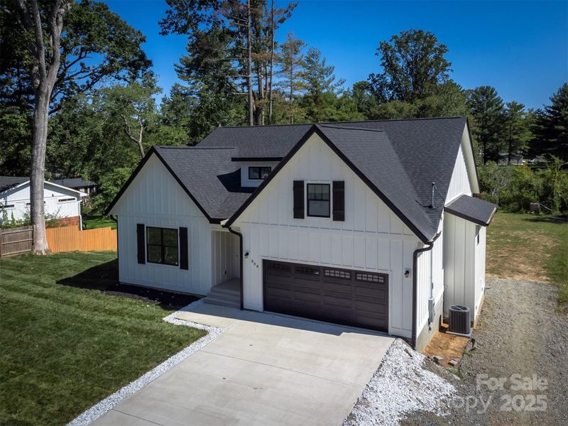 Front exterior of a new home in , Hendersonville, NC, highlighting curb appeal (Image 23).