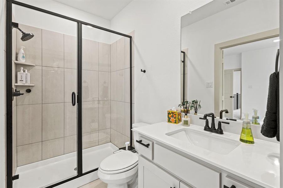 Bathroom with vanity and a stall shower