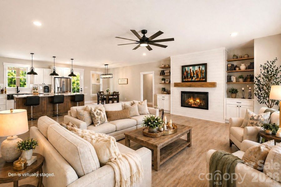 Open plan with virtual staging. Huge Den with LVP flooring.