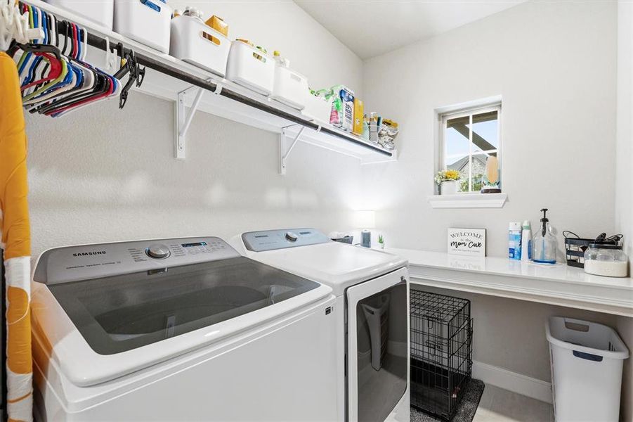 Large walk-in laundry room with folding counter Large walk-in laundry room with folding counter