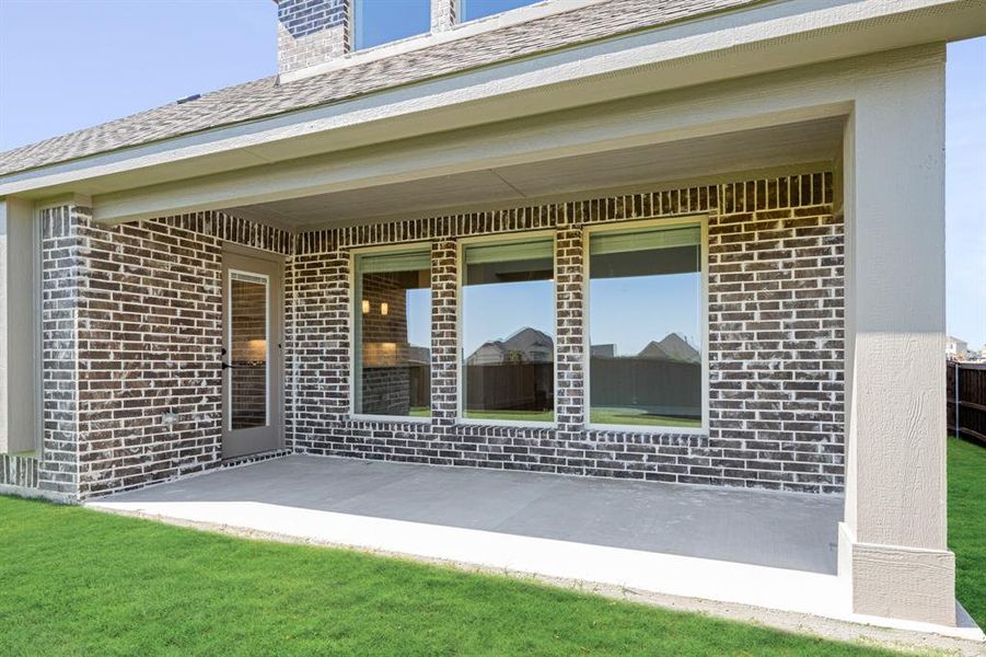 Exterior details and patio area of a home in Wildcat Ridge Phase 3, Godley (Image 4).