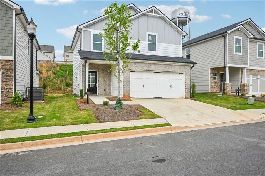 Front exterior of a new home in Hawthorne Station, College Park, GA, highlighting curb appeal (Image 24).