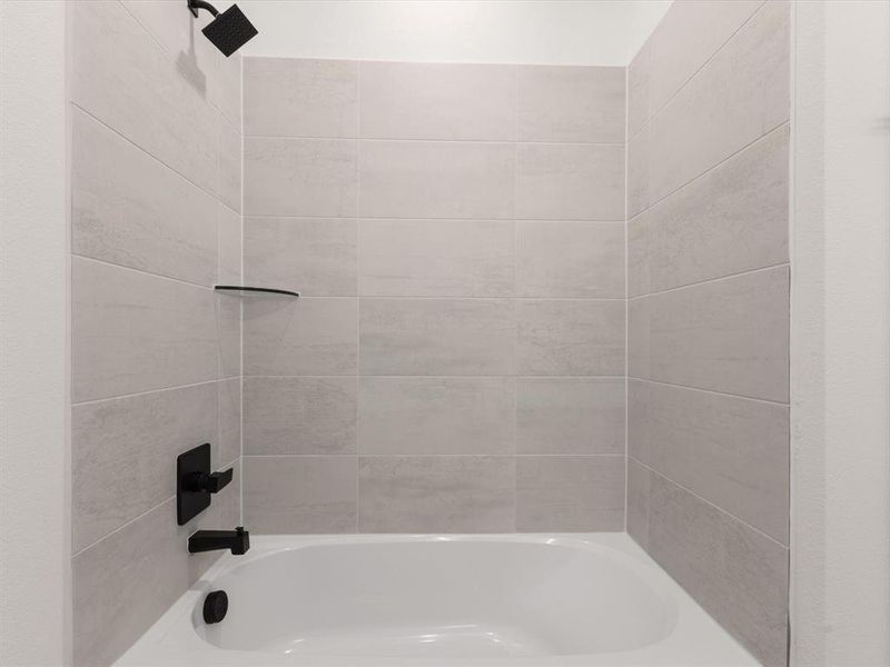 Ensuite bathroom featuring  shower combination