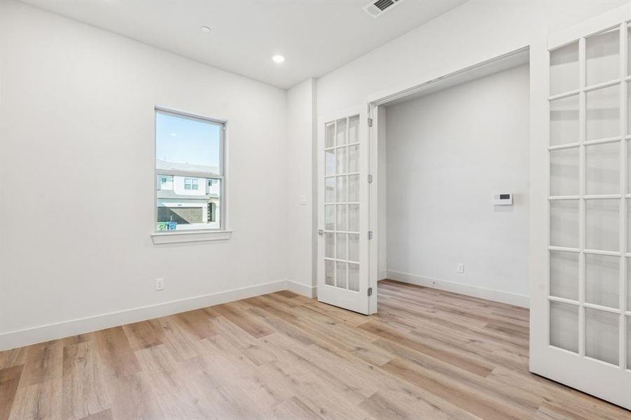 Flex space on first floor great for home office.