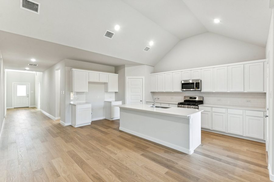 Kitchen in the Wimbledon home plan by Trophy Signature Homes – REPRESENTATIVE PHOTO Kitchen in the Wimbledon home plan by Trophy Signature Homes – REPRESENTATIVE PHOTO