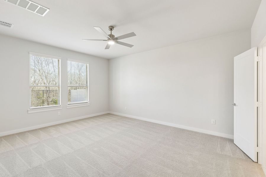 Primary Suite in the Masters home plan by Trophy Signature Homes – REPRESENTATIVE PHOTO