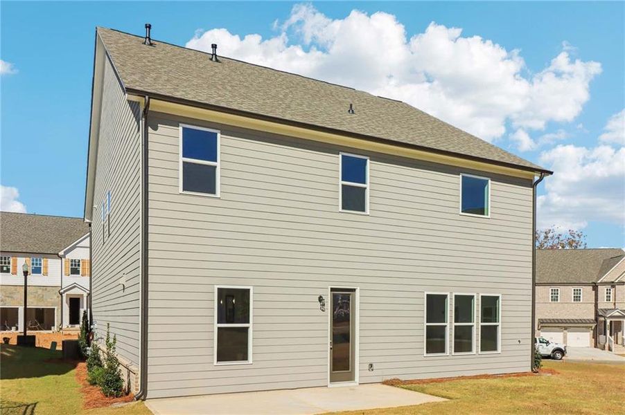 Exterior details and patio area of a home in East Harbor II at Chestatee, Dawsonville (Image 28).