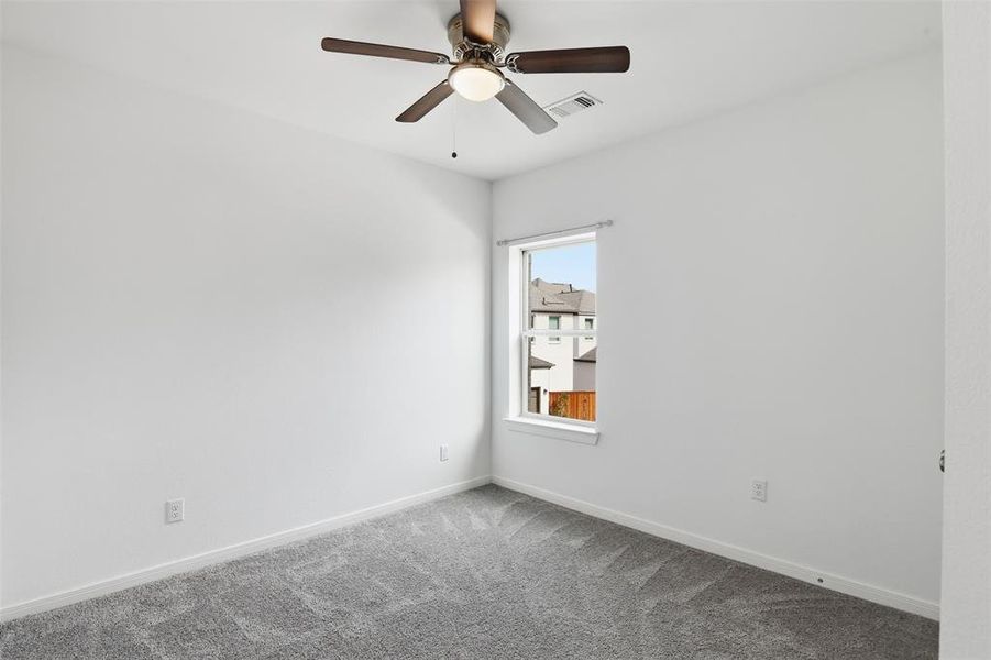 Bedroom 2 with ceiling fan.
