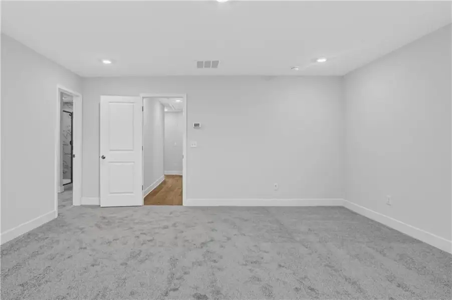 Spacious, unfurnished interior of a new home in Towns at Holly Springs, Holly Springs (Image 22).