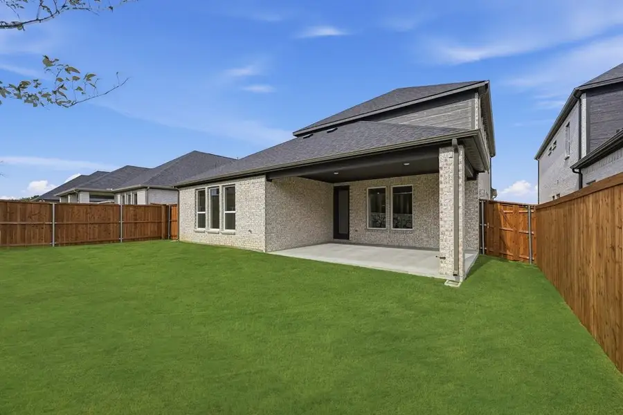 Exterior details and patio area of a home in South Oak, Lakewood Village (Image 19).