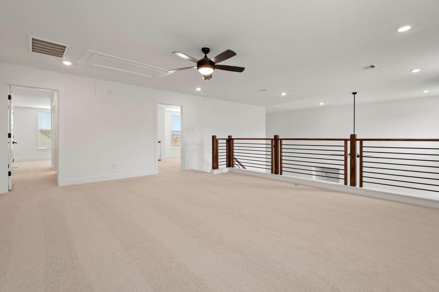 Carpeted upstairs game room.