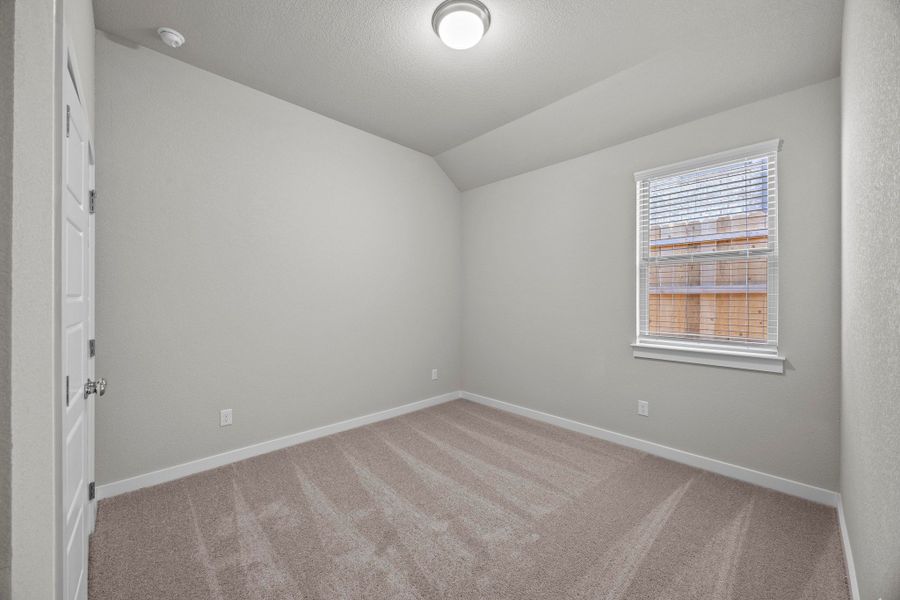 Bedroom in the Cedar home plan by Trophy Signature Homes – REPRESENTATIVE PHOTO