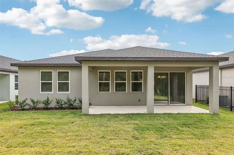 Exterior details and patio area of a home in , Ormond Beach (Image 4).