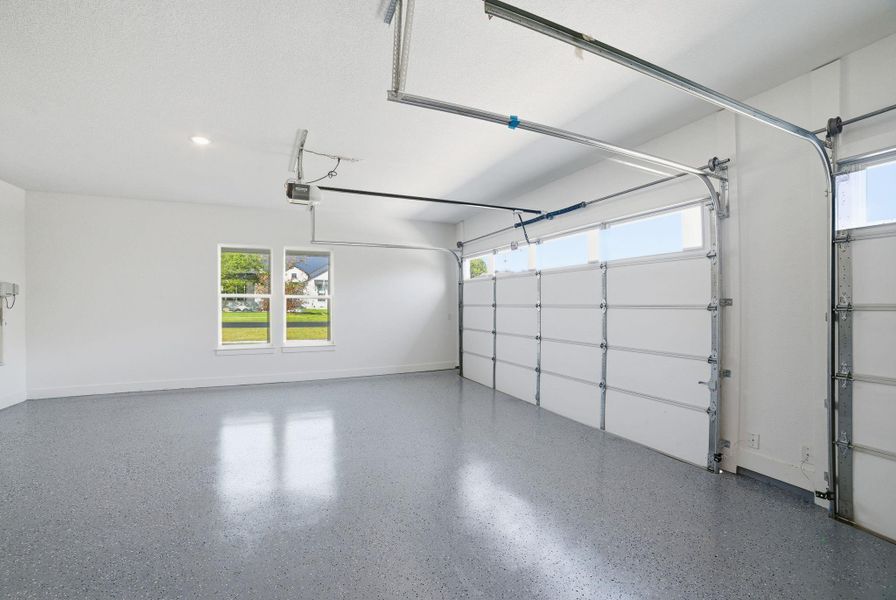 Garage featuring baseboards Garage featuring baseboards