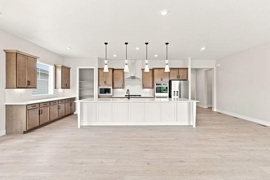 Furnished interior view inside a new home in Hilltop at Inspiration, Aurora (Image 6).