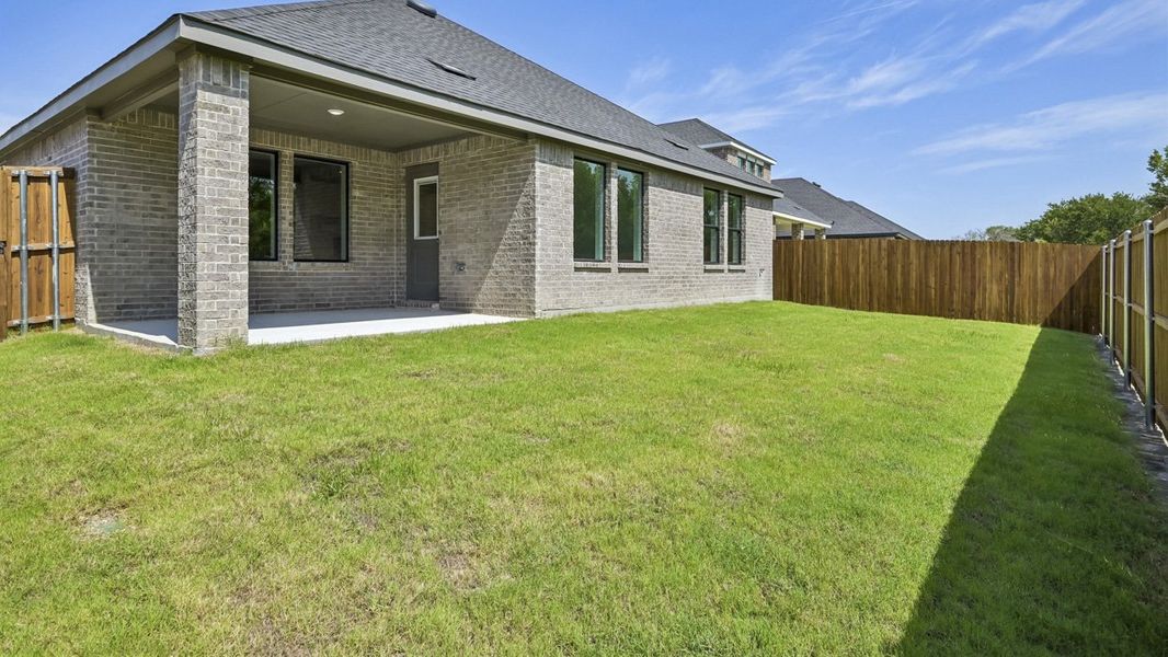 Exterior details and patio area of a home in Windchime, Celina (Image 2). Exterior details and patio area of a home in Windchime, Celina (Image 2).