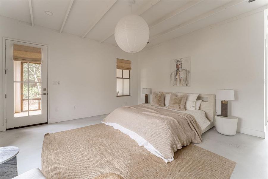 Bedroom with light wood-style floors, a ceiling fan, and beam ceiling Bedroom with light wood-style floors, a ceiling fan, and beam ceiling