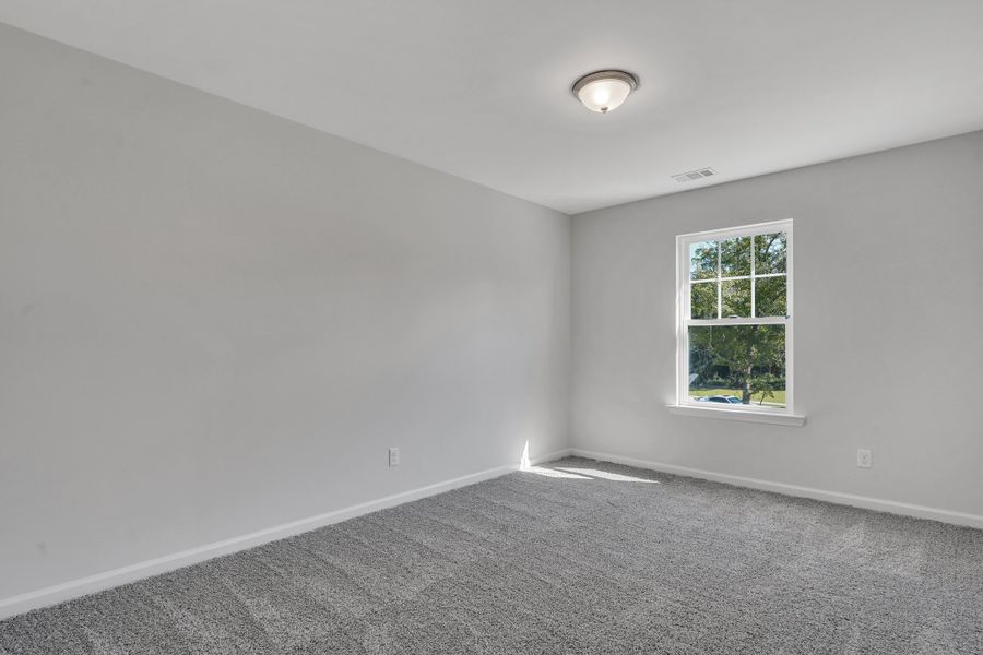 Representative unfurnished interior of a home built from the The Hatteras by Smith Family Homes in Ramsey Landing, Rincon (Image 30).