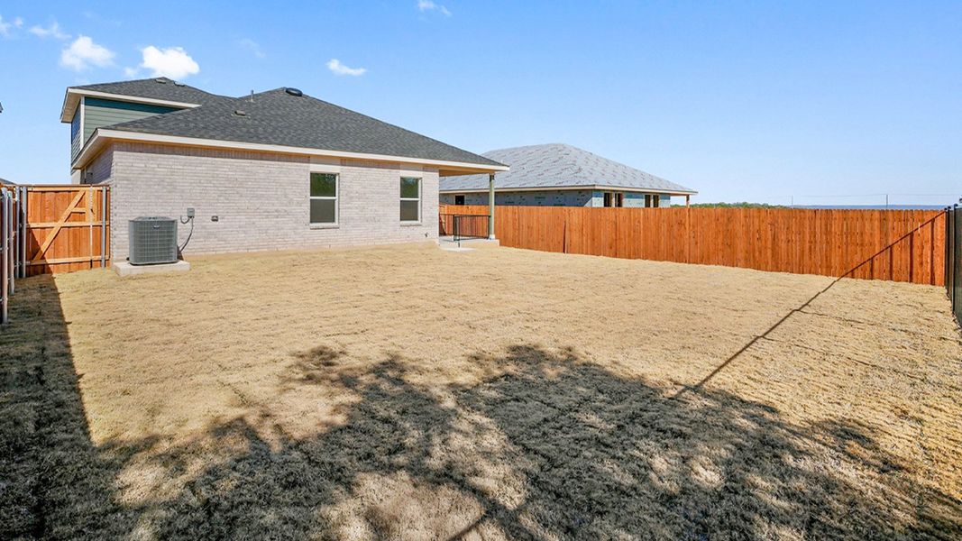 Exterior details and patio area of a home in Thunder Rock, Marble Falls (Image 20).