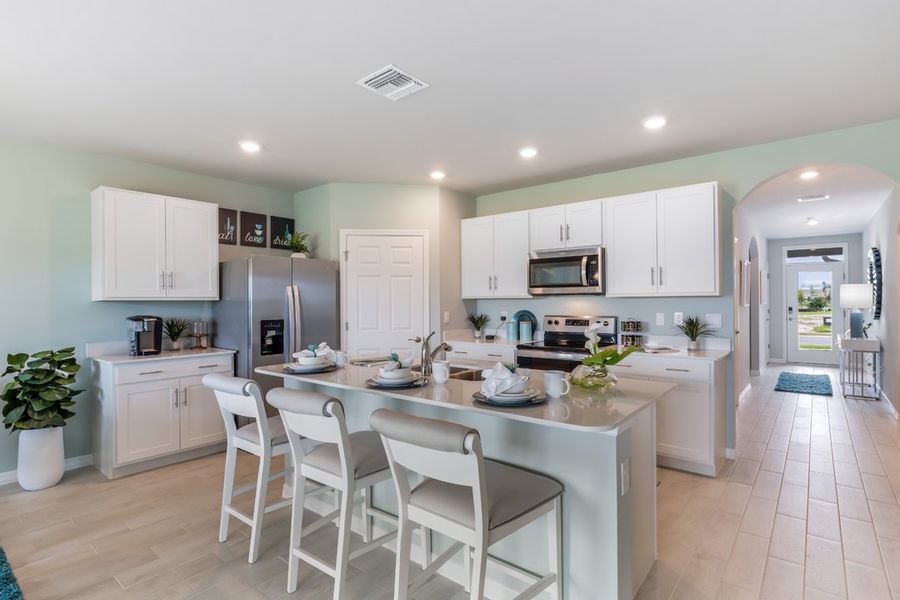 Representative furnished interior of a home built from the Cali by D.R. Horton in Coral Bay - Express & Tradition, North Fort Myers (Image 8).