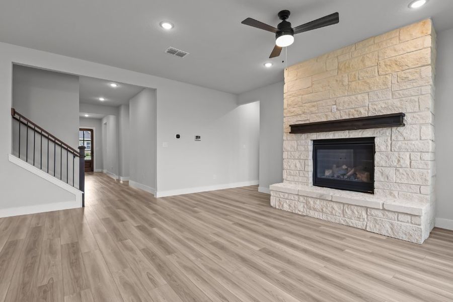 A large living room with a fireplace. A large living room with a fireplace.