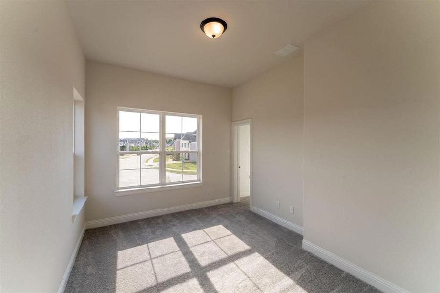 View of carpeted spare room