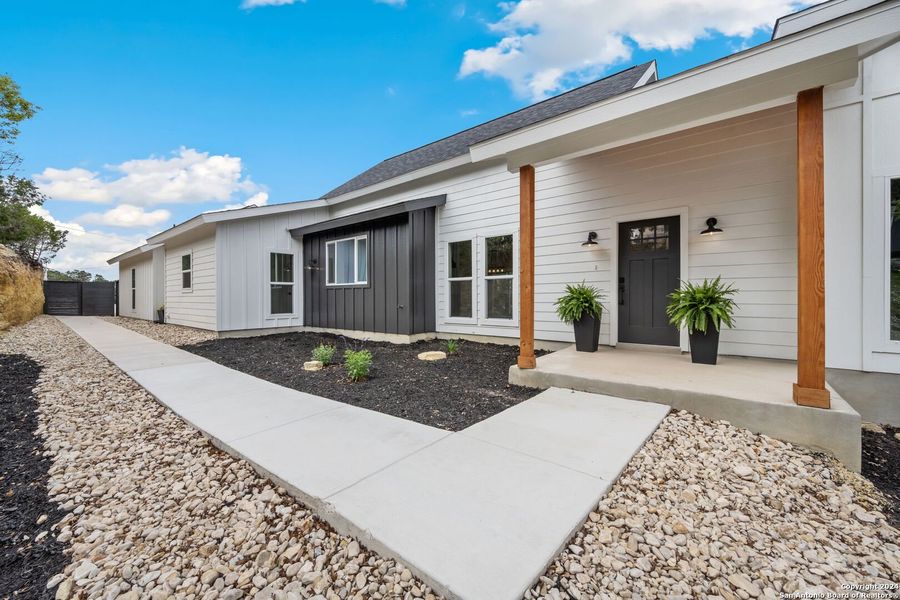 Front exterior of a new home in , Canyon Lake, TX, highlighting curb appeal (Image 23).