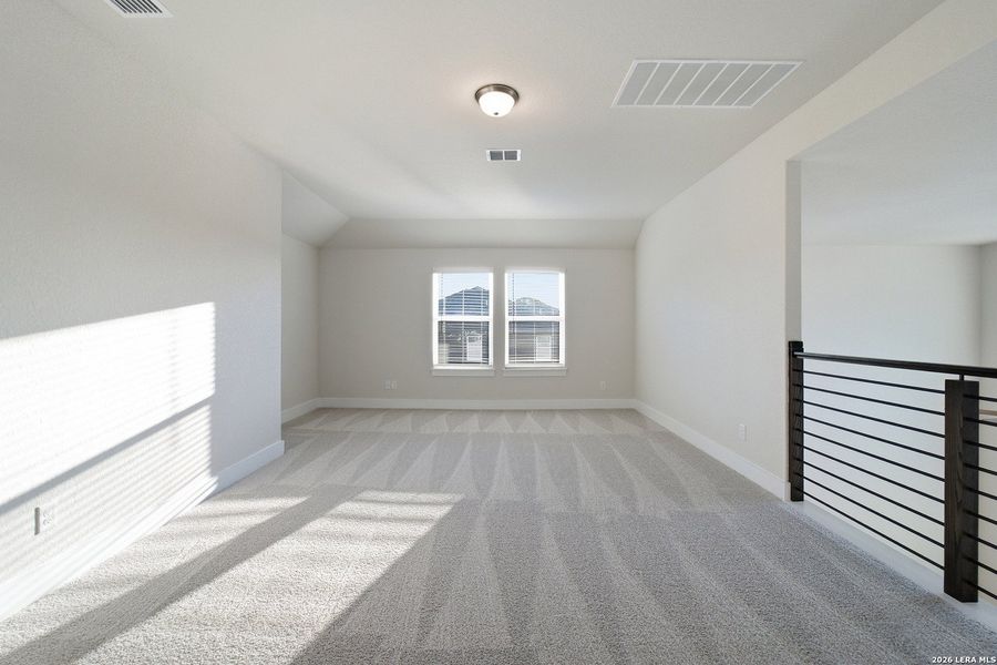 Spacious, unfurnished interior of a new home in The Woodlands at Medina Hills, Mico (Image 29).