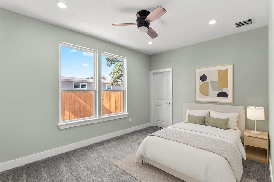 Virtually staged Carpeted bedroom number 3 with ceiling fan and recessed lighting