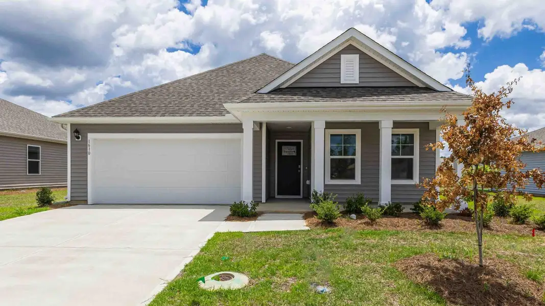 Front exterior of a new home in Patriot Pointe at Towne Pointe, Jacksonville, NC, highlighting curb appeal (Image 1). Front exterior of a new home in Patriot Pointe at Towne Pointe, Jacksonville, NC, highlighting curb appeal (Image 1).
