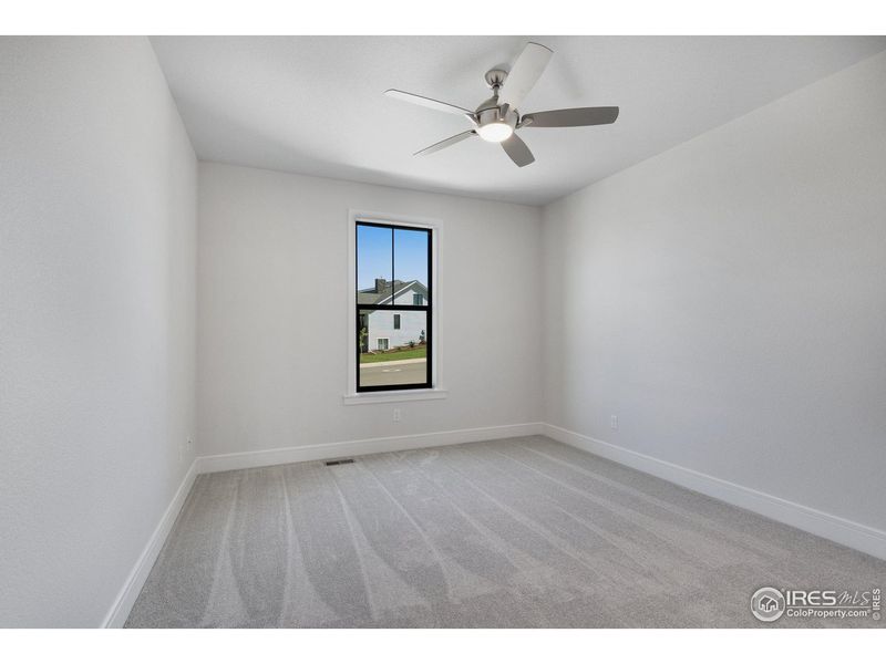 Spacious, unfurnished interior of a new home in Cottages at Kelly Farm, Greeley (Image 25).