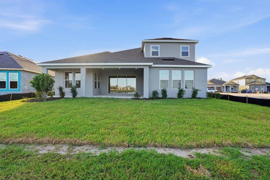 Exterior details and patio area of a home in Palms at Coasterra, Palmetto (Image 26).